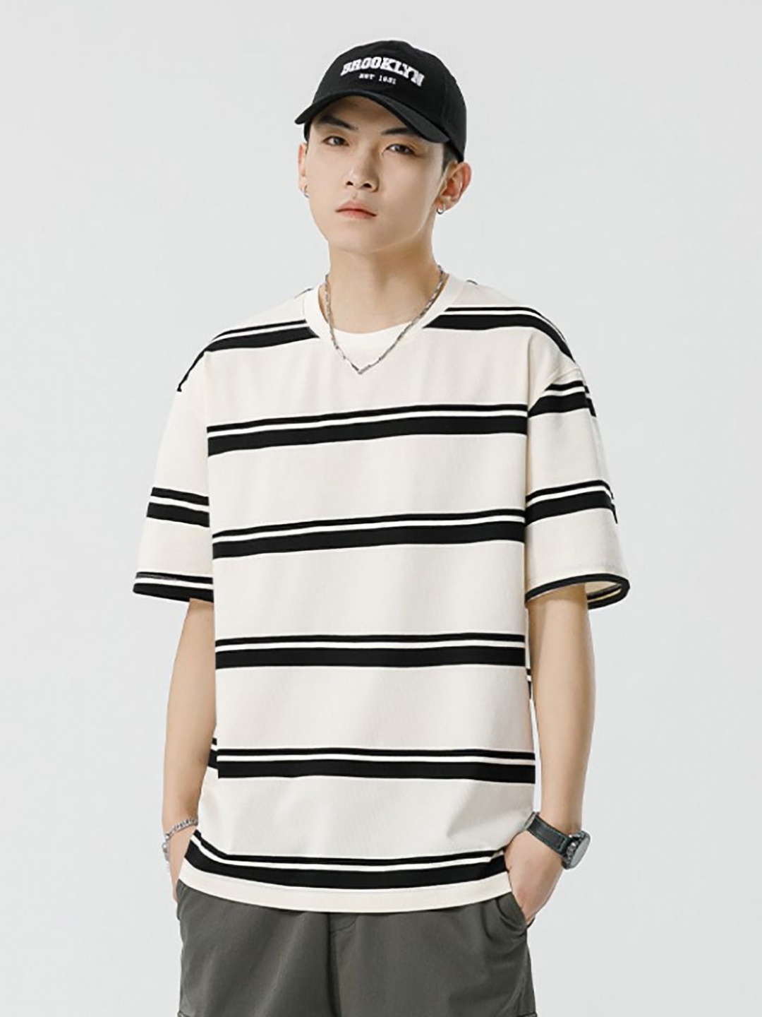 

StyleCast x Revolte Men Striped Round Neck Cotton Oversized T-shirt, Off white