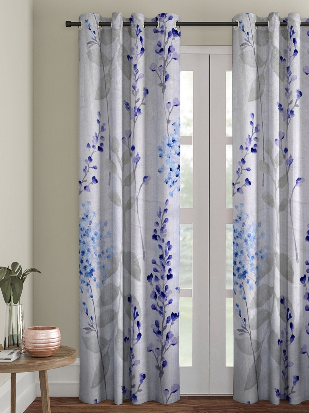 

Myntra Elegant Homes Off White & Blue Floral Room Darkening Door Curtain