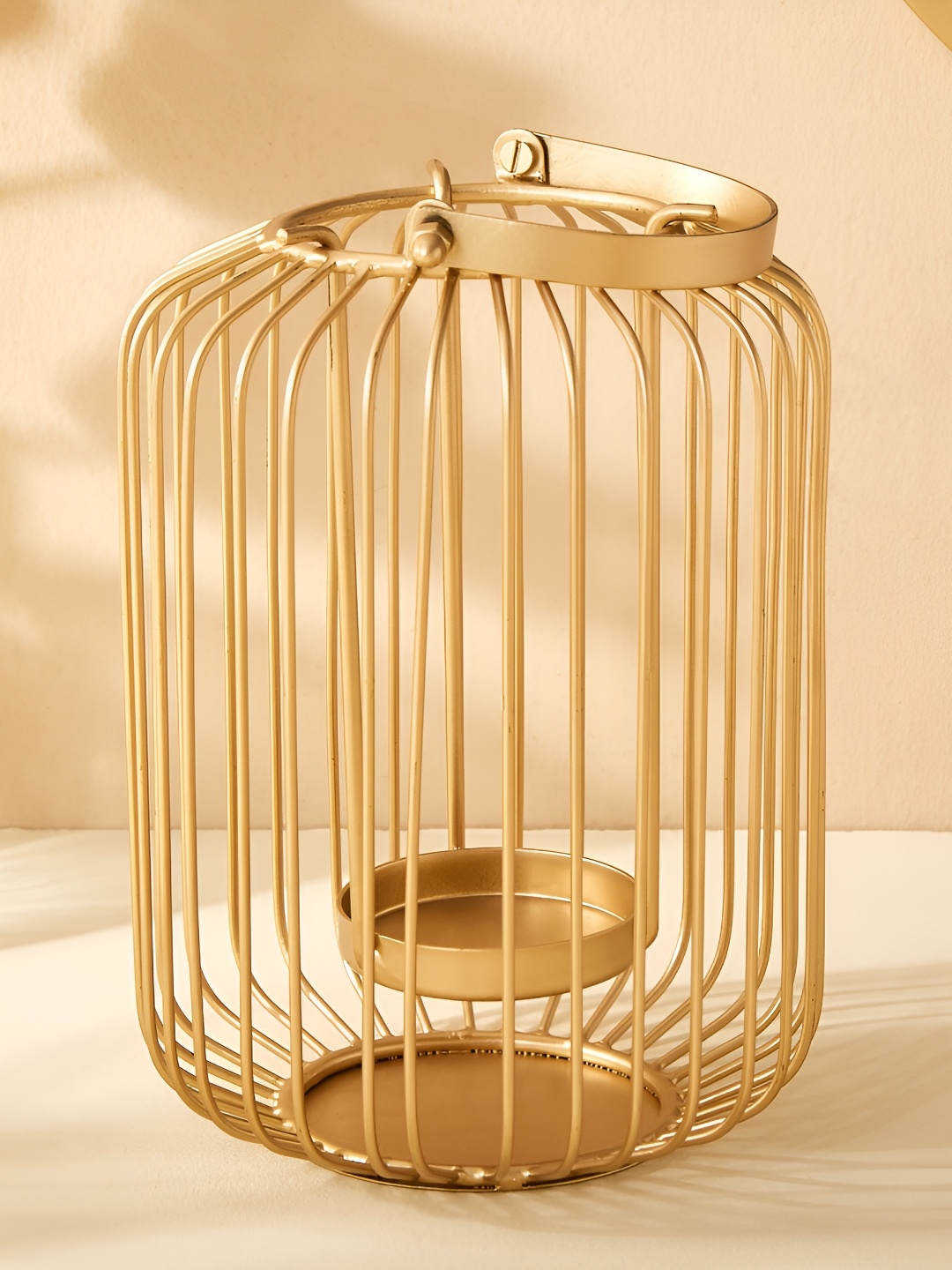 

Home Centre Leon Ottor Beige Metal Lantern Candle Holder