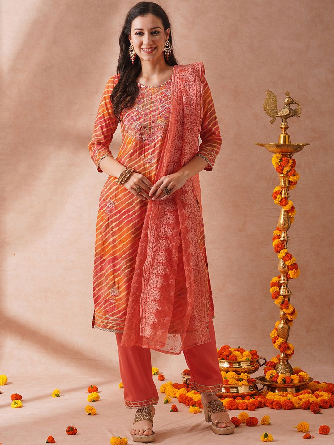 

FASHOR Women Leheriya Printed Regular Mirror Work Kurta with Trousers & With Dupatta, Orange