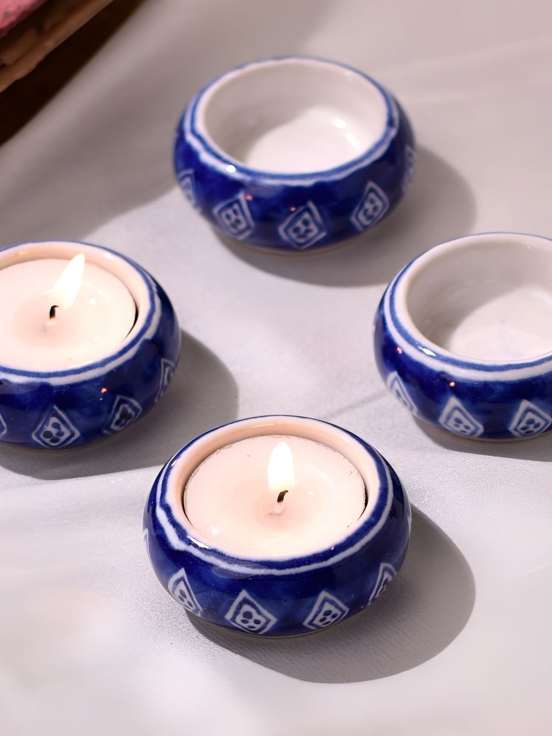 

Indianshelf Blue & White 4 Pieces Printed Ceramic Candle Holders