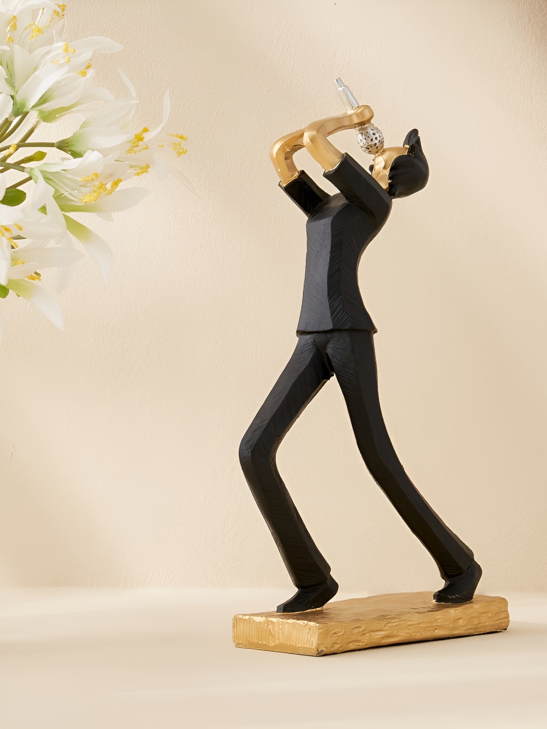 

Home Centre Corsica Black & Gold-toned Musical Human Figurine Showpiece