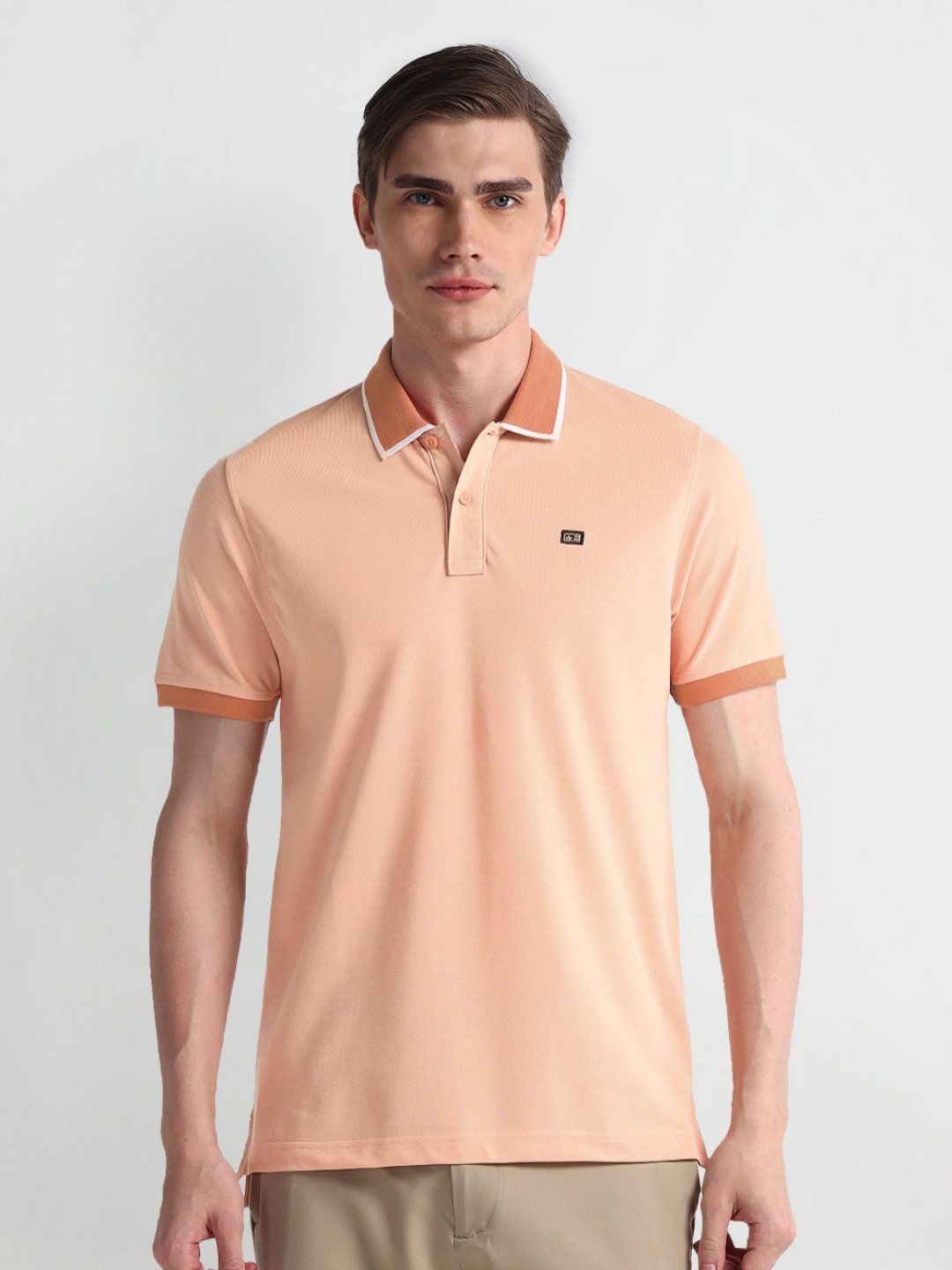 

Arrow Sport Men Solid Polo Collar Cotton T-shirt, Pink