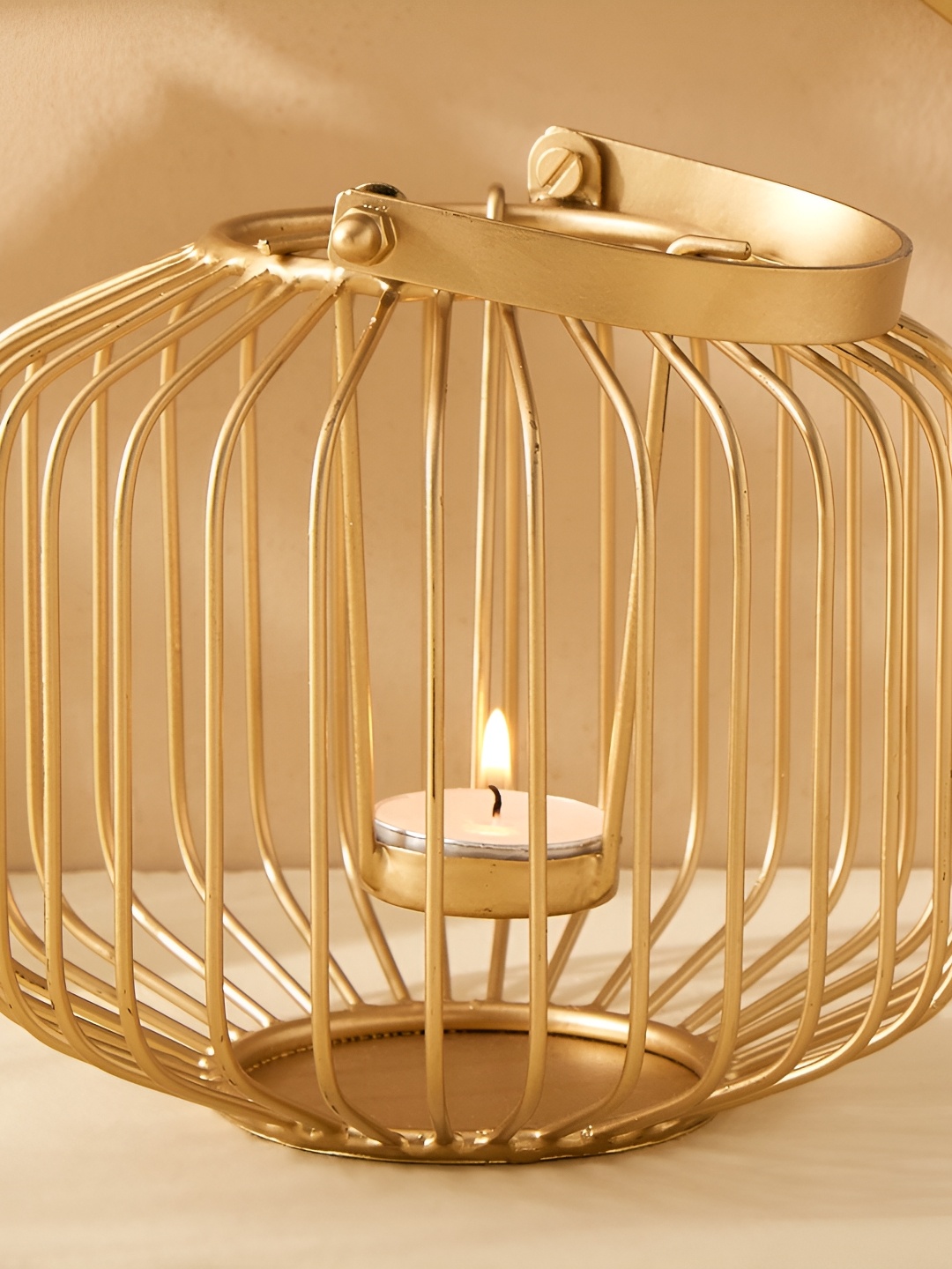 

Home Centre Gold Toned Metal Wire Lantern Candle Holder