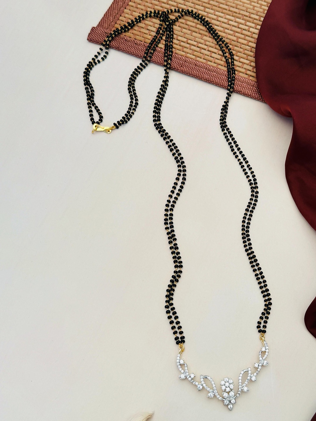 

Anouk Gold-Plated Artificial Stones and Beads Mangalsutra