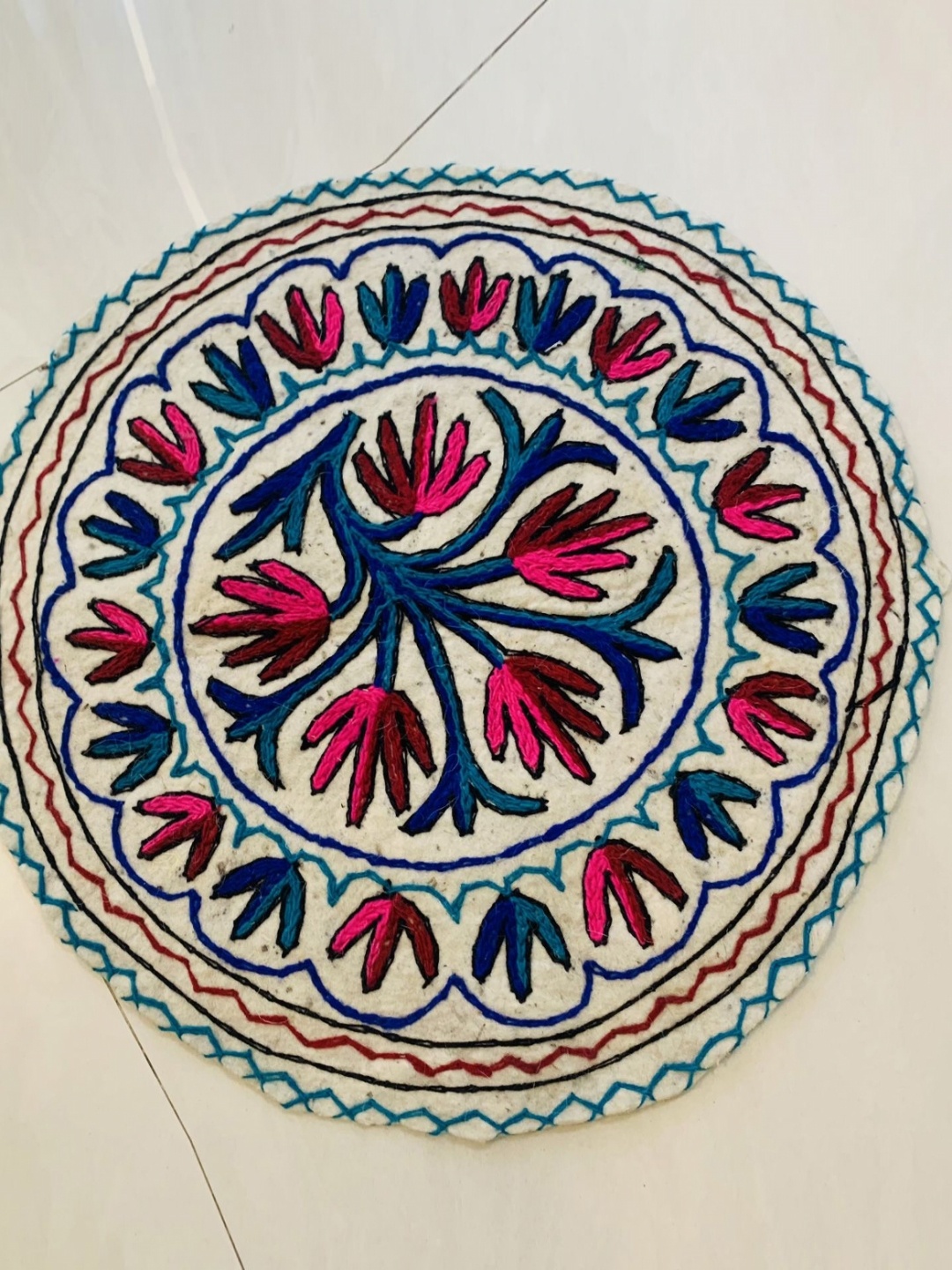 

Swadeh White & Red Ethnic Motifs Woollen Floor Mat