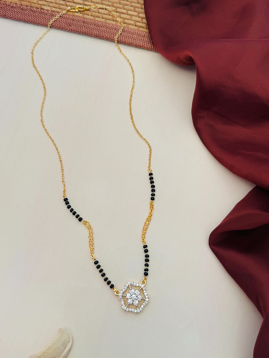 

Anouk Gold-Plated Artificial Stones and Beads Mangalsutra