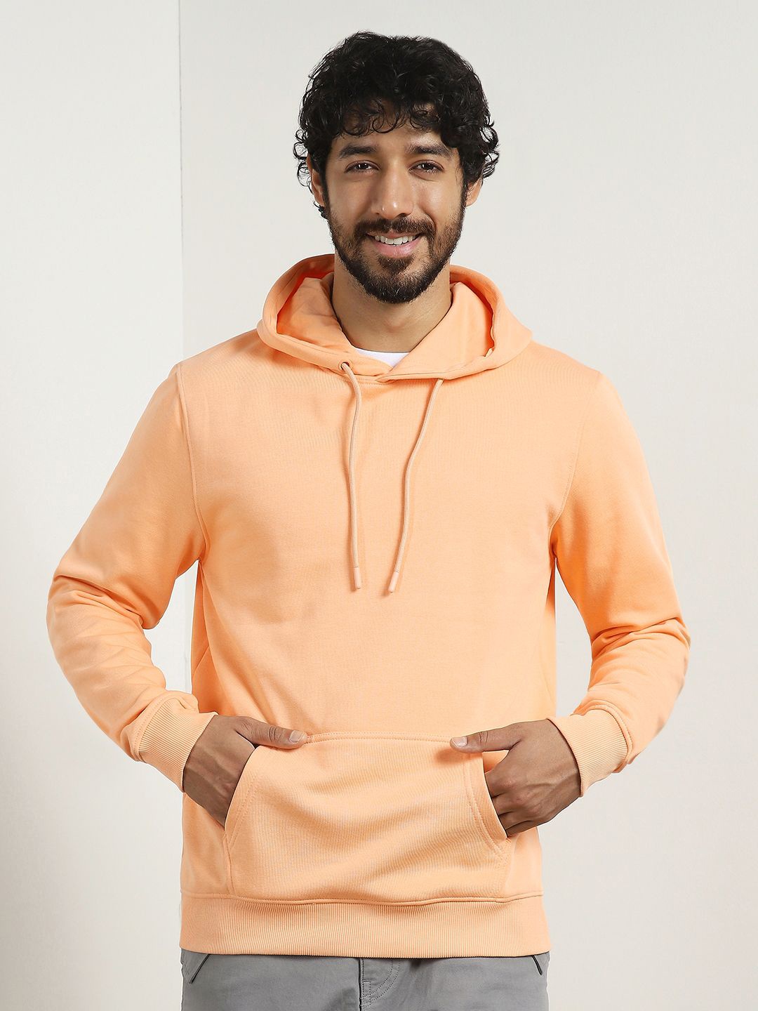 

Nobero Men Solid Hoodie, Peach
