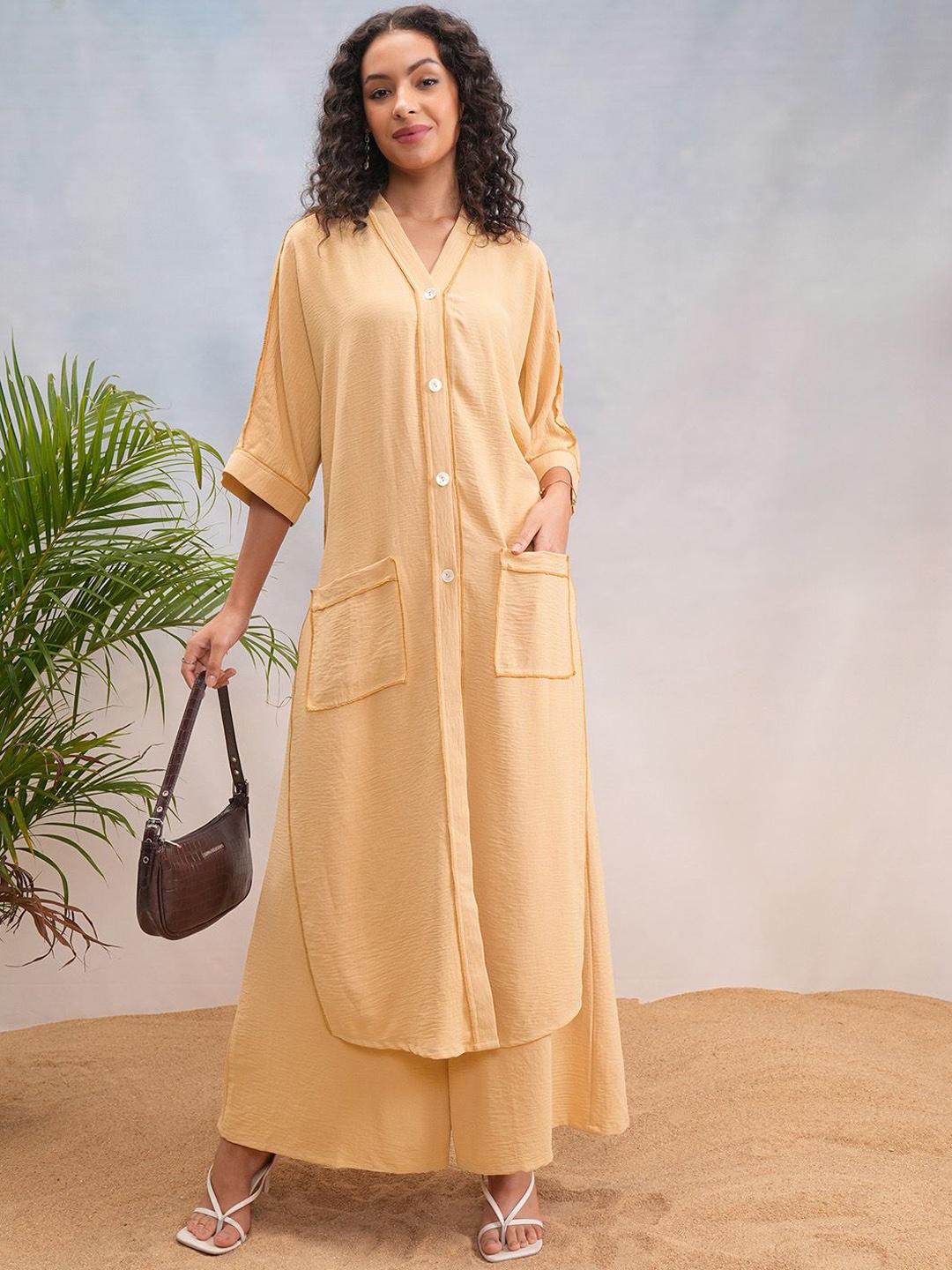 

Vishudh Beige V Neck Three Quarter Sleeve Tunic & Palazzos