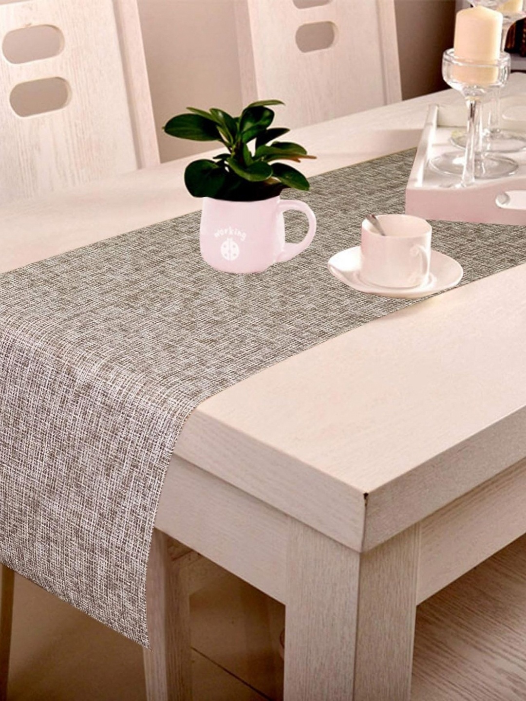 

Lushomes Black Self Design 6 Seater Table Runner