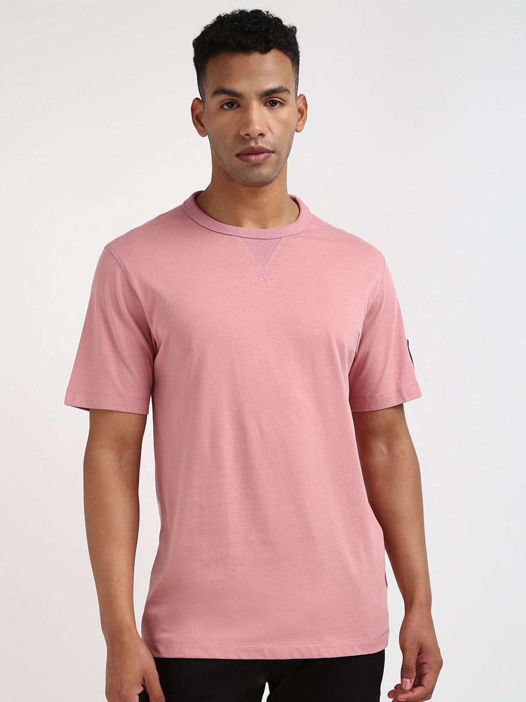 

Calvin Klein Jeans Men Solid Round neck Cotton T-shirt, Pink