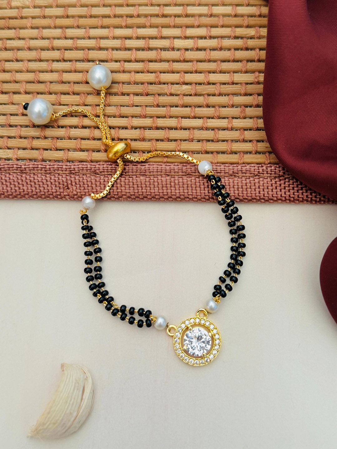 

Anouk Gold-Plated Artificial Stones and Beads Mangalsutra