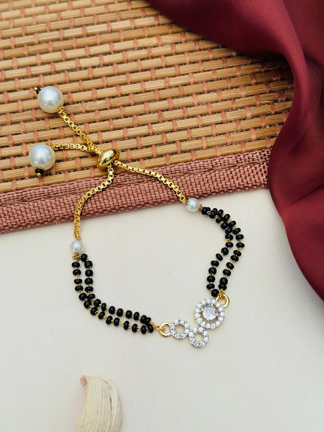 

Anouk Gold-Plated Artificial Stones and Beads Mangalsutra