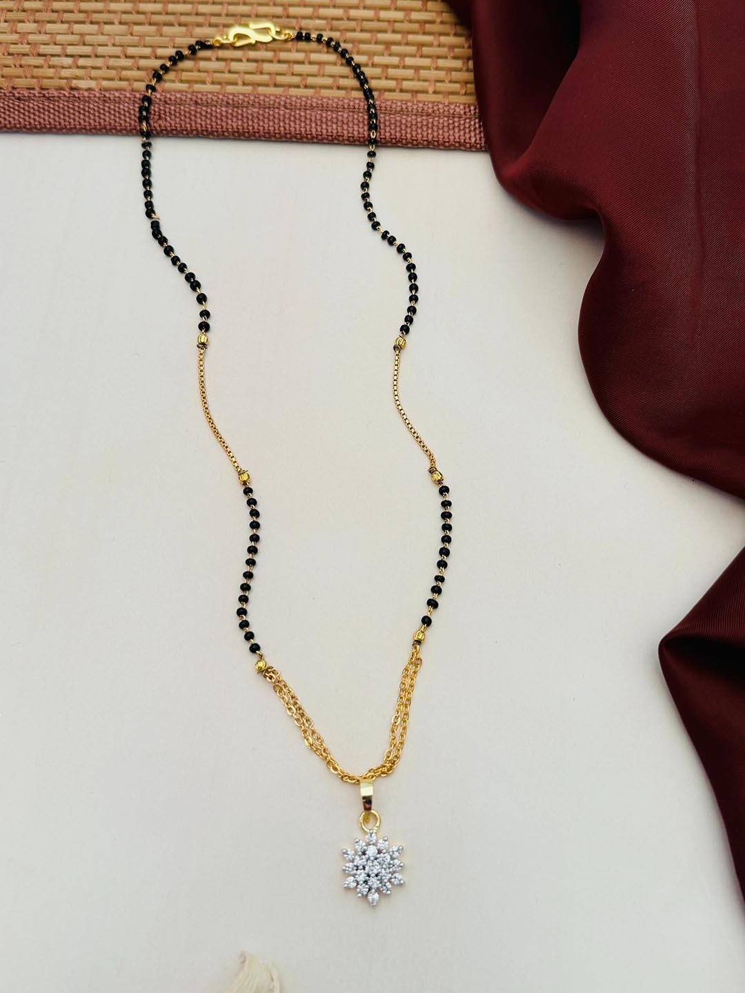 

Anouk Gold-Plated Artificial Stones and Beads Mangalsutra