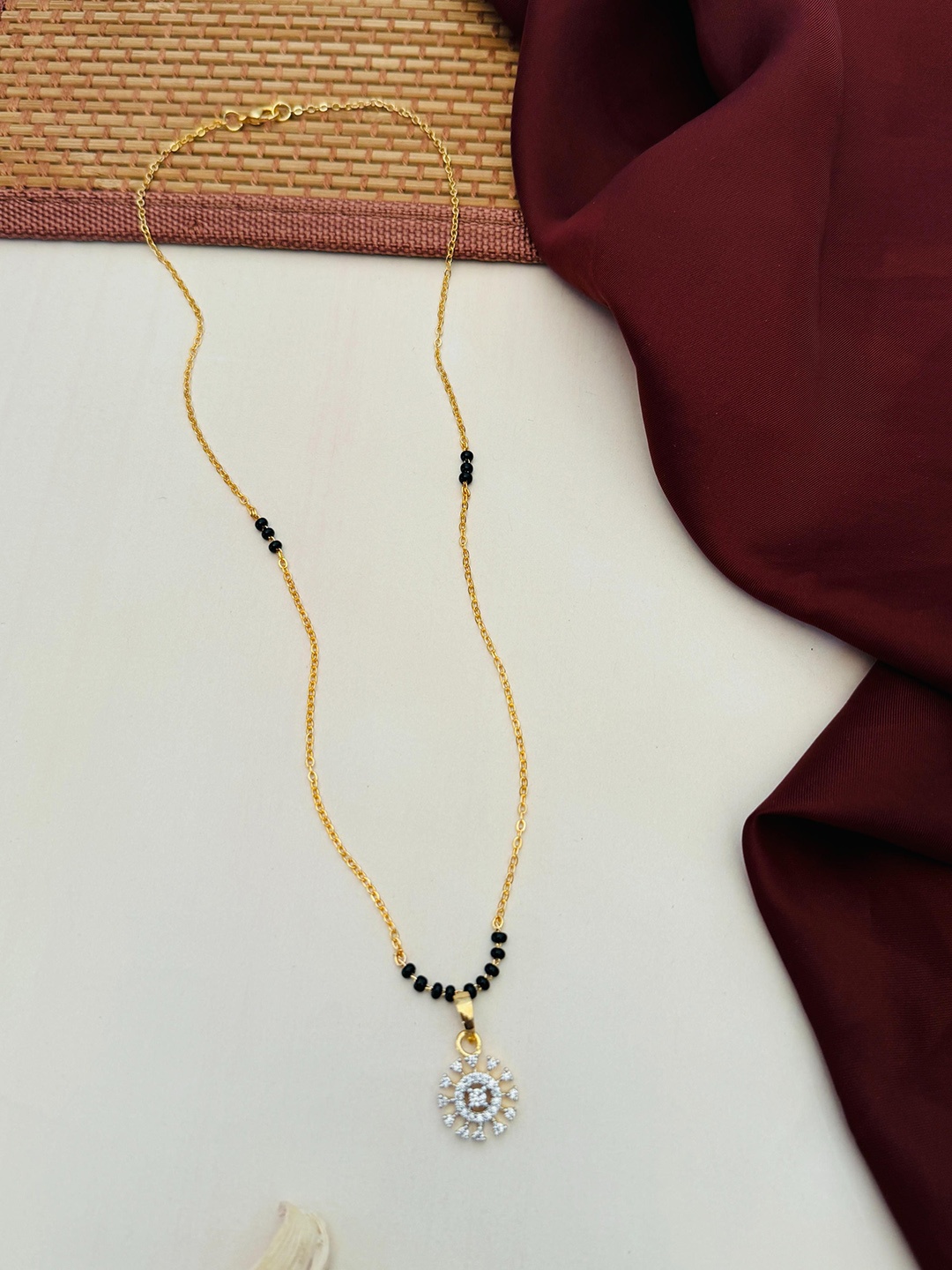 

Anouk Gold-Plated Artificial Stones and Beads Mangalsutra