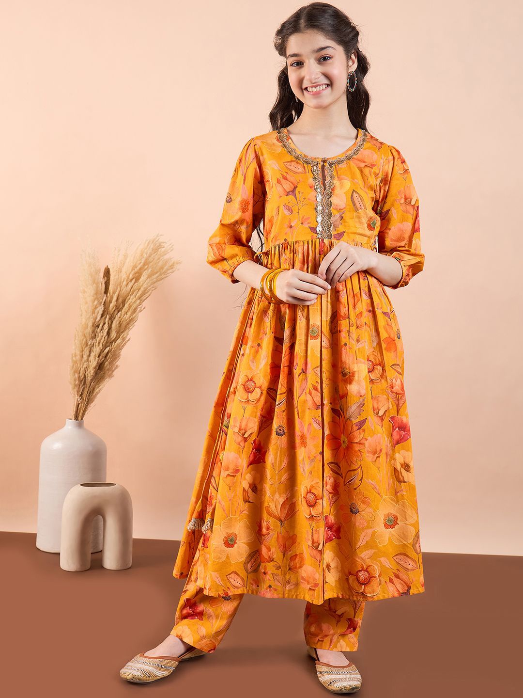 

Stylo Bug Girls Floral Printed Empire Gotta Patti Pure Cotton Kurta with Pyjamas, Mustard