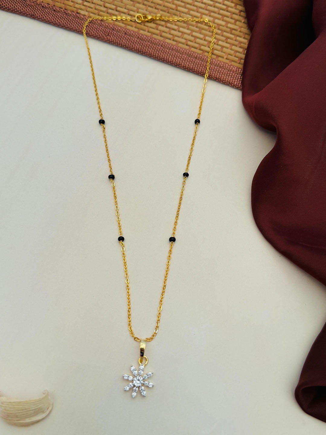 

Anouk Gold-Plated Artificial Stones and Beads Mangalsutra