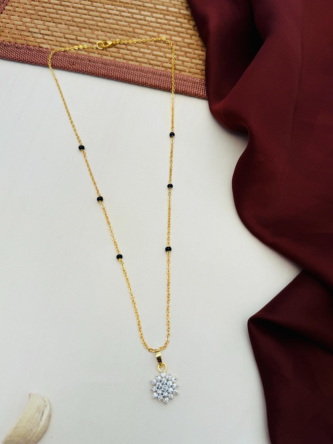 

Anouk Gold-Plated Artificial Stones and Beads Mangalsutra