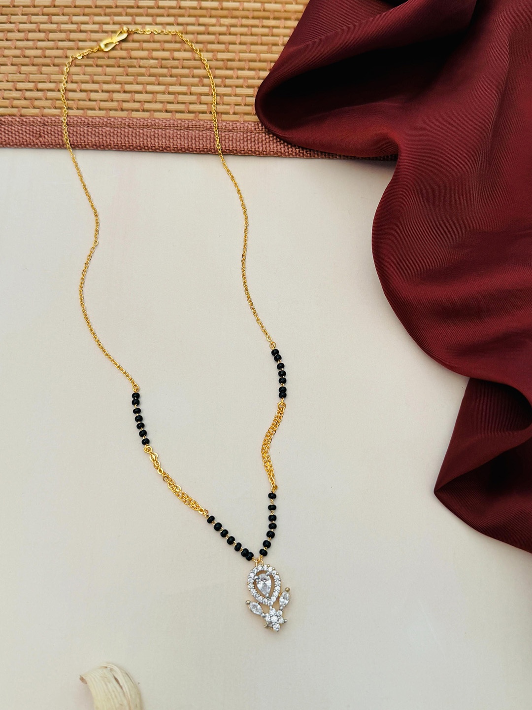 

Anouk Gold-Plated Artificial Stones and Beads Mangalsutra