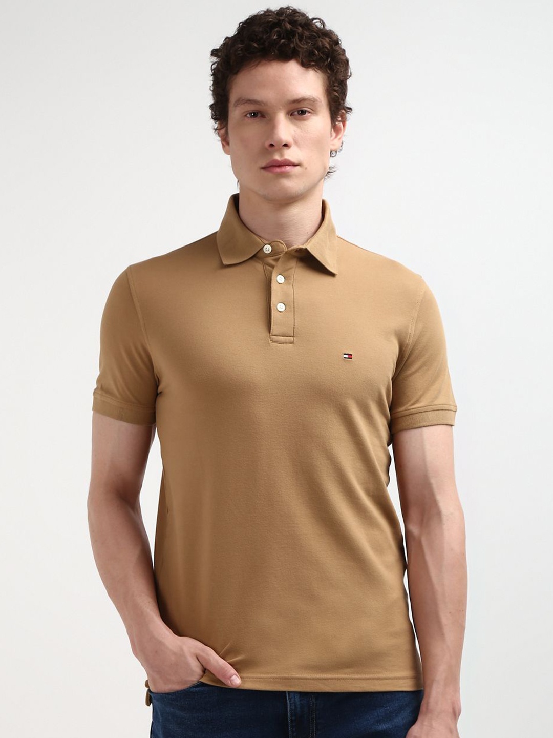 

Tommy Hilfiger Men Solid Polo Collar Pure Cotton Slim Fit T-shirt, Tan