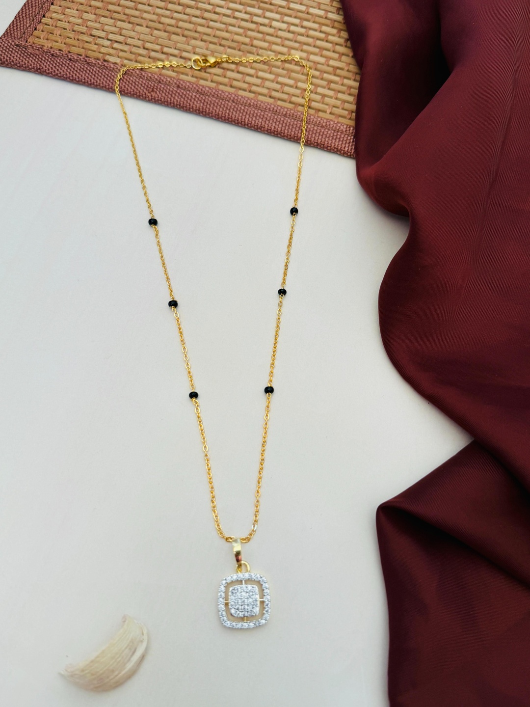 

Anouk Gold-Plated Artificial Stones and Beads Mangalsutra