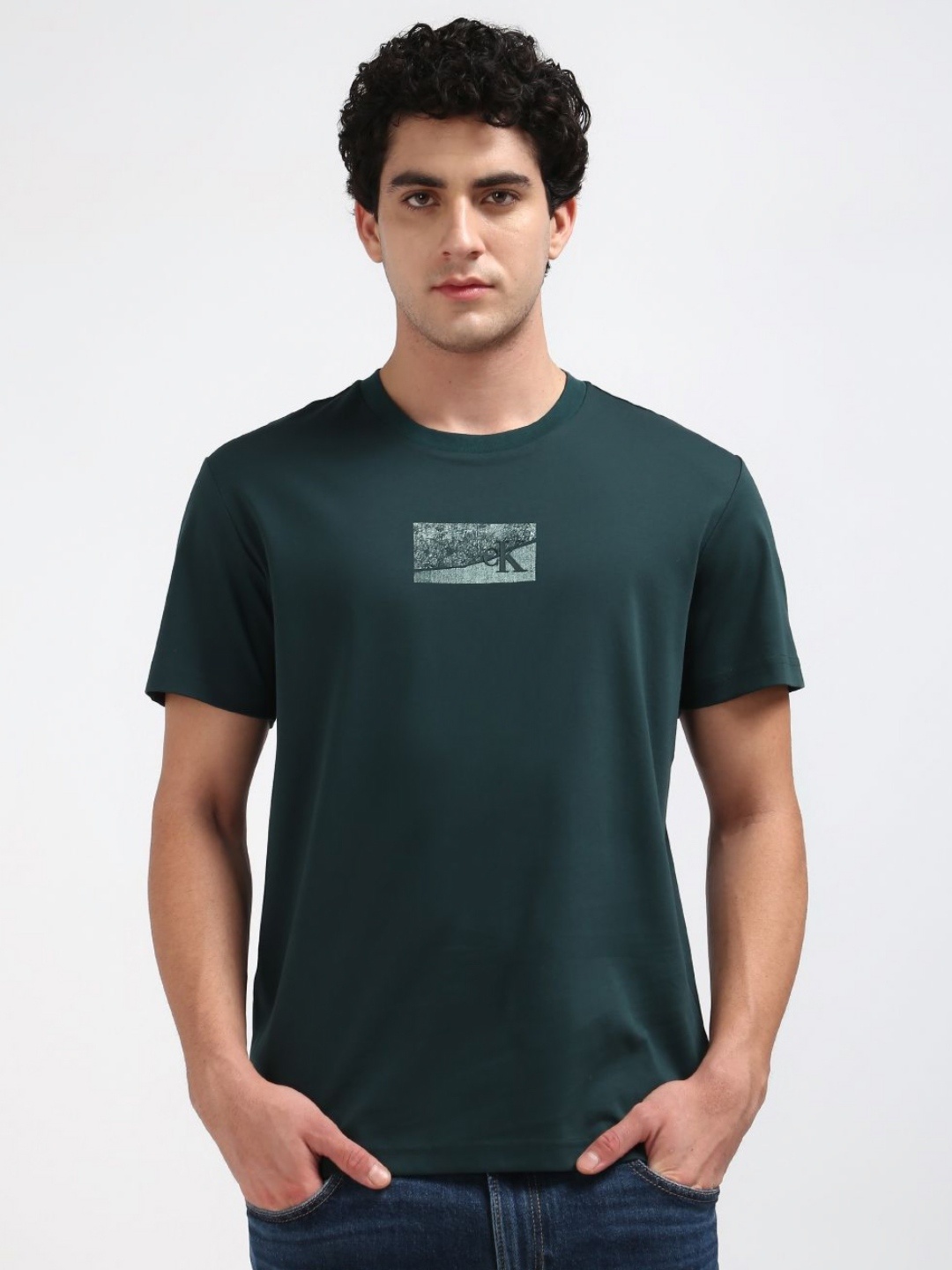 

Calvin Klein Jeans Men Abstract Printed Round Neck Cotton T-shirt, Brown