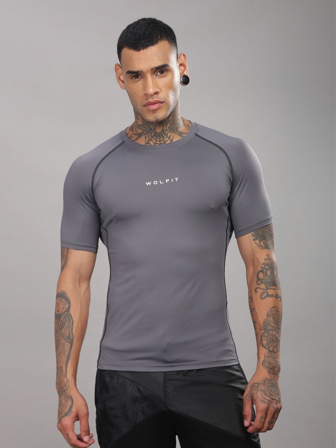 

WOLFIT ATHLEISURE Men Dri-FIT Solid Round Neck Compression T-shirt, Grey