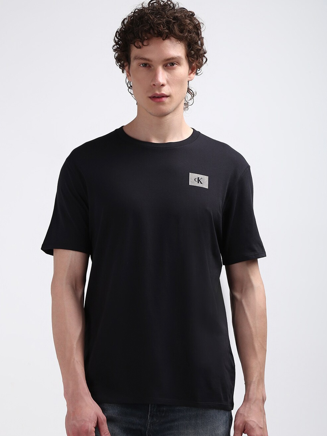 

Calvin Klein Jeans Men Round Neck Solid T-shirt, Black