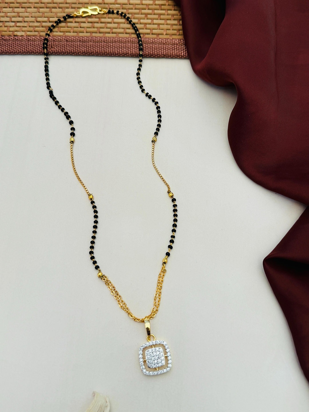 

Anouk Gold-Plated Artificial Stones and Beads Mangalsutra