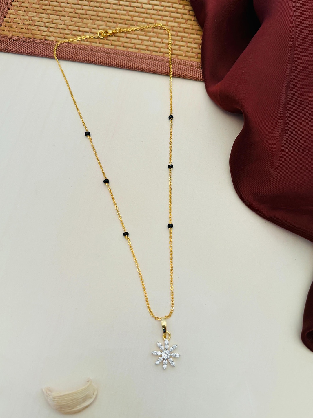 

Anouk Gold-Plated Artificial Stones and Beads Mangalsutra