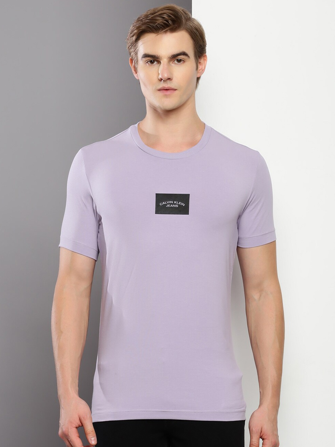 

Calvin Klein Jeans Men Solid Slim Fit T-shirt, Purple