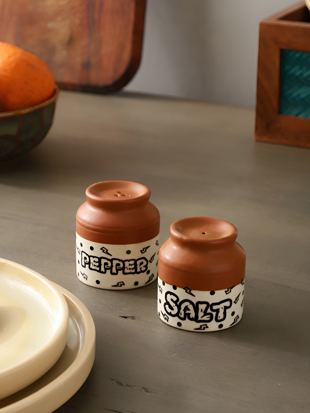 

The Decor Mantra Brown & White 2 Pieces Ceramic Salt and Pepper Shakers