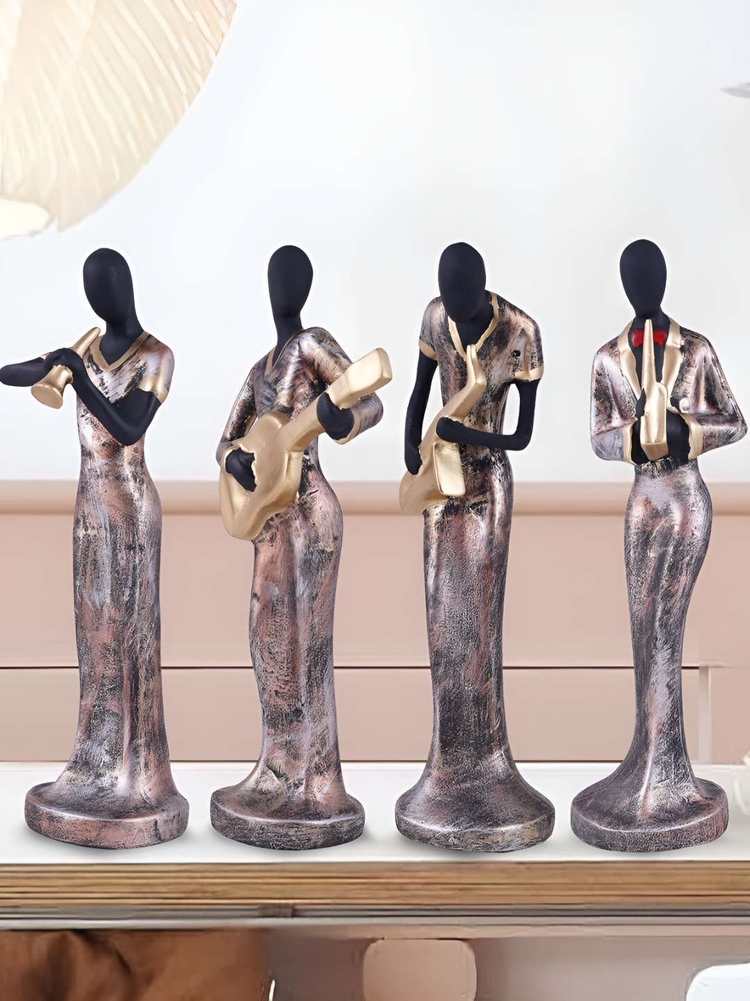 

Zart Black & Gold Toned 4 Pieces Figurine Showpiece