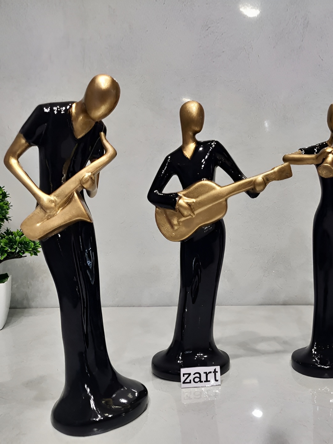

Zart Black & Gold Toned 4 Pieces Musical Instrument Statue Figurine Showpiece