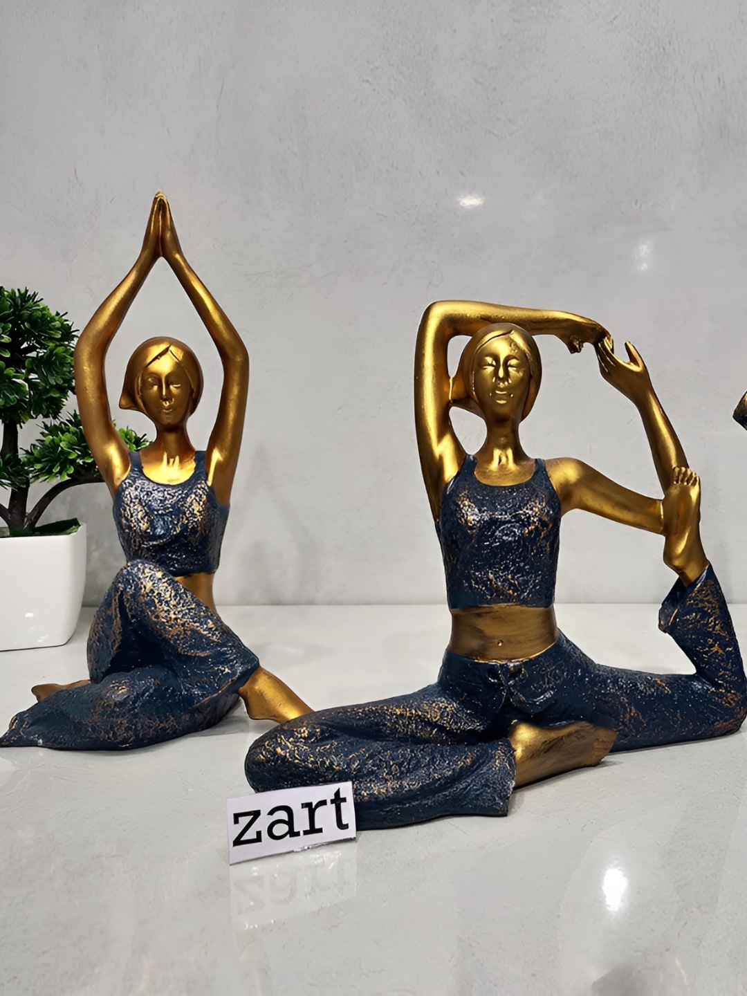 

Zart Blue & Gold Toned Yoga Lady Figurine Showpiece