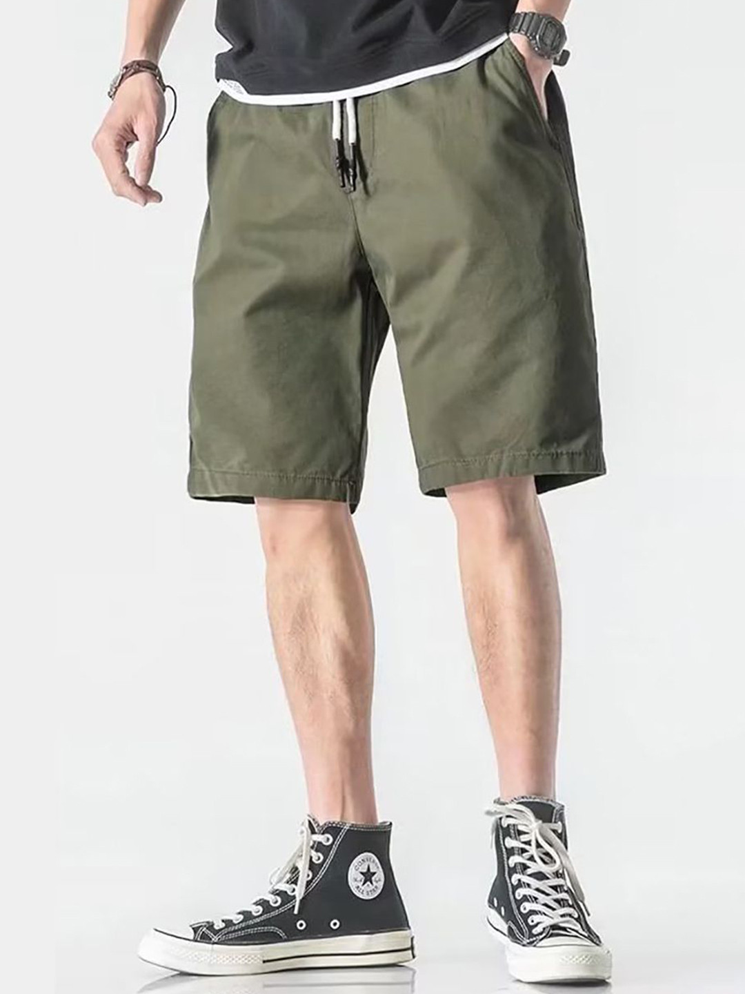 

StyleCast x Revolte Men Solid Mid-Rise Shorts, Green