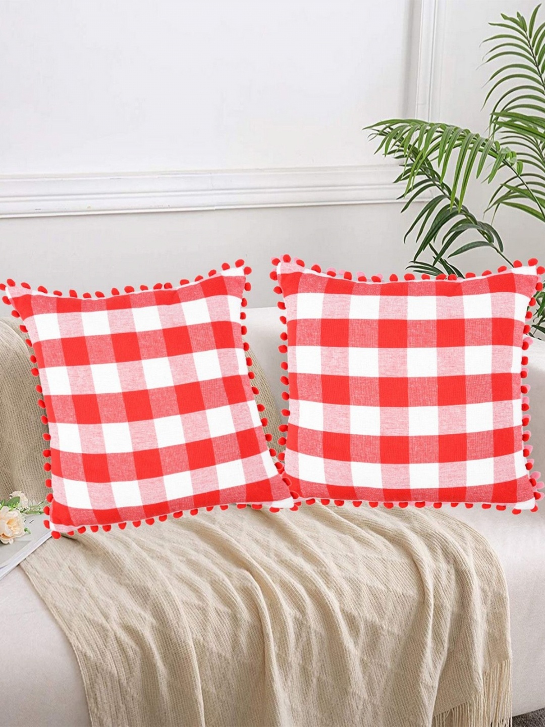 

Lushomes Red & White 2 Pieces Checked Square Cushion Covers With Pom Pom