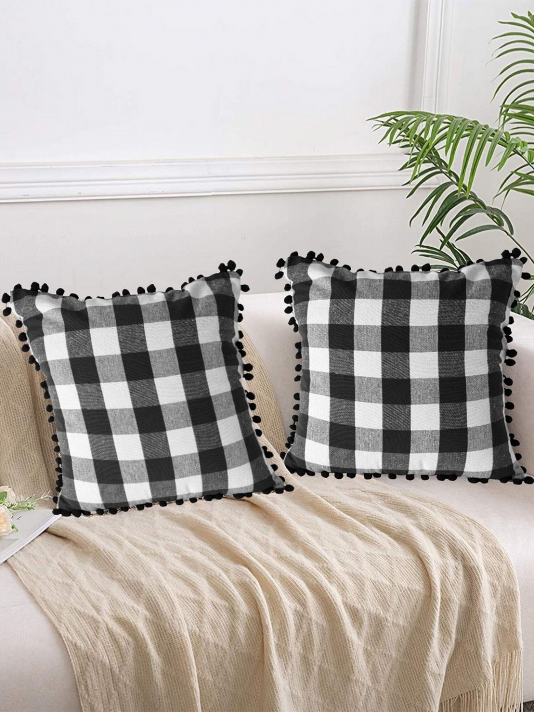 

Lushomes Black & White 2 Pieces Checked Square Cushion Covers With Pom Pom