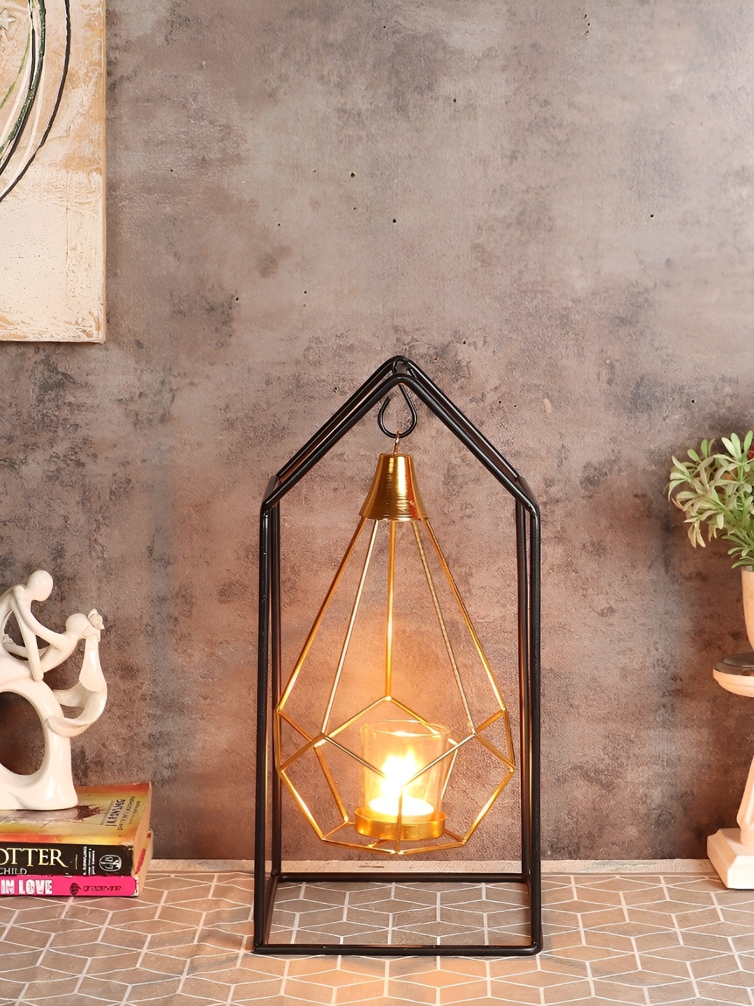 

Amaya Decors Gold-Toned & Black Hut Shape Diamond Pendulum Tealight Candle Holder