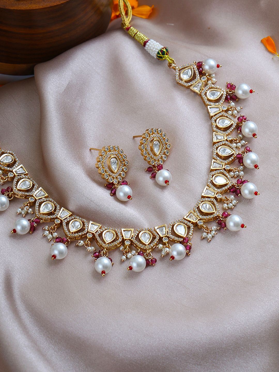 

Adwitiya Collection Gold-Plated Kundan Studded & Pearls Beaded Jewellery Set