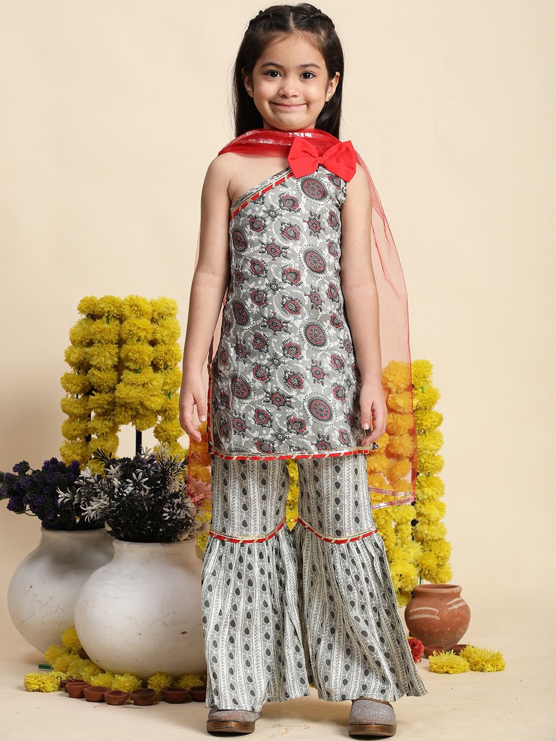 

Cutiekins Girls Ethnic Motifs Printed One Shoulder Straight Kurta With Sharara & Dupatta, Grey