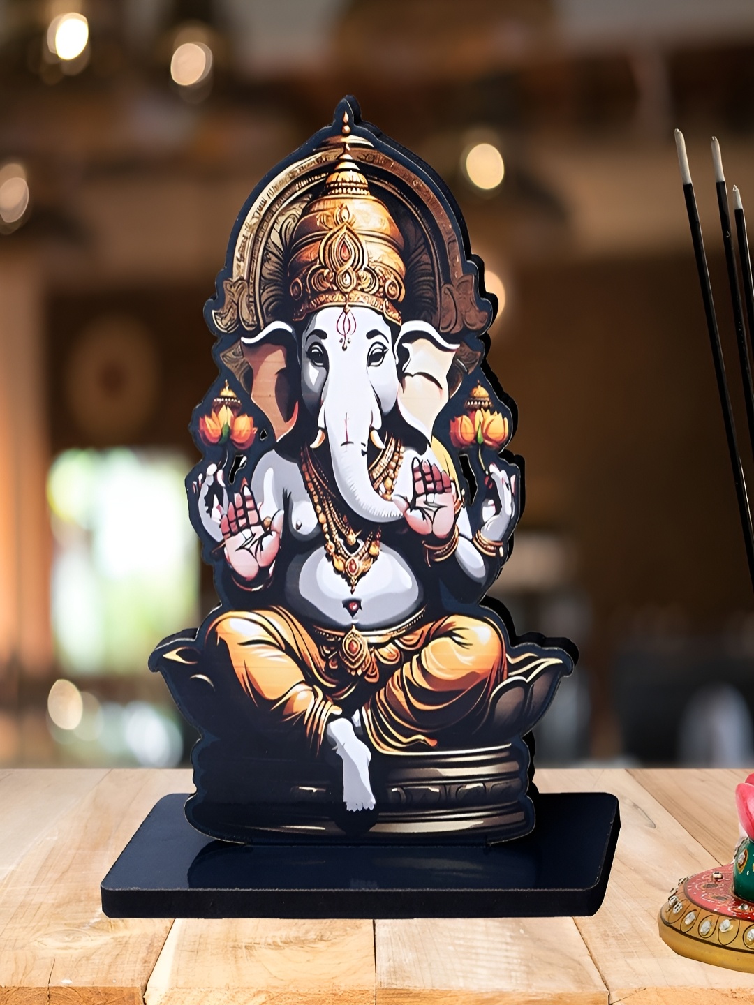 

Home Delight Black & Gold Toned Lord Ganesha Idol Wooden Showpiece