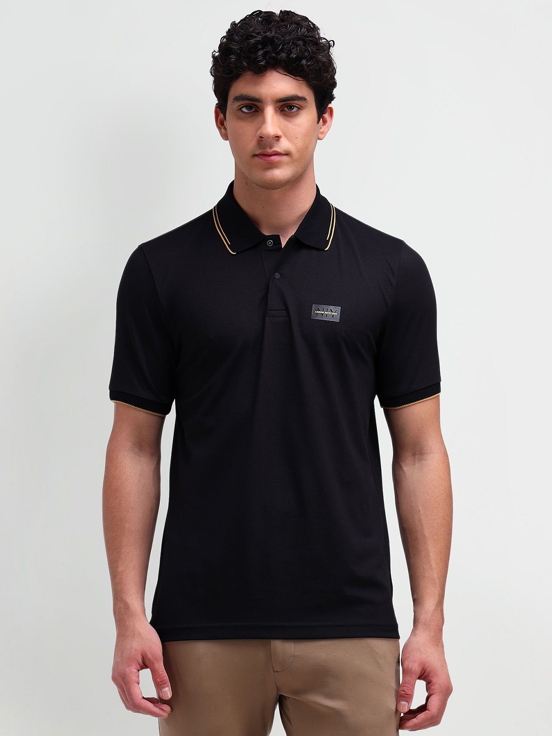 

Arrow New York Men Solid Polo Collar Cotton T-shirt, Black