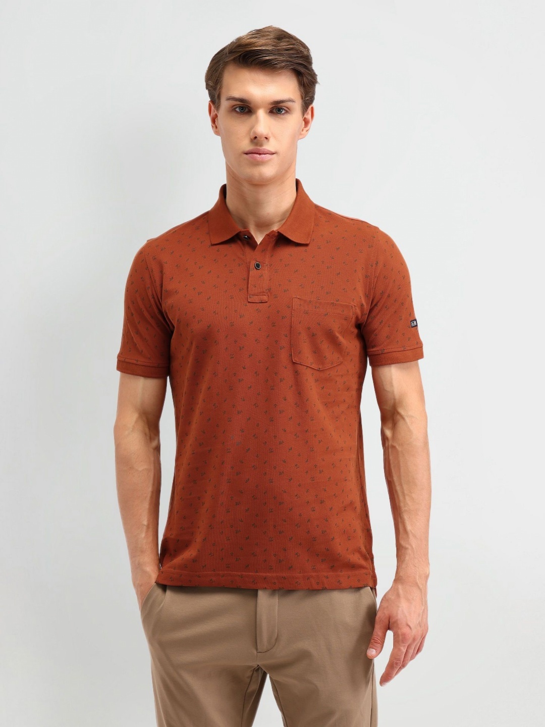 

Arrow Sport Men Abstract Printed Polo Collar Cotton T-shirt, Rust