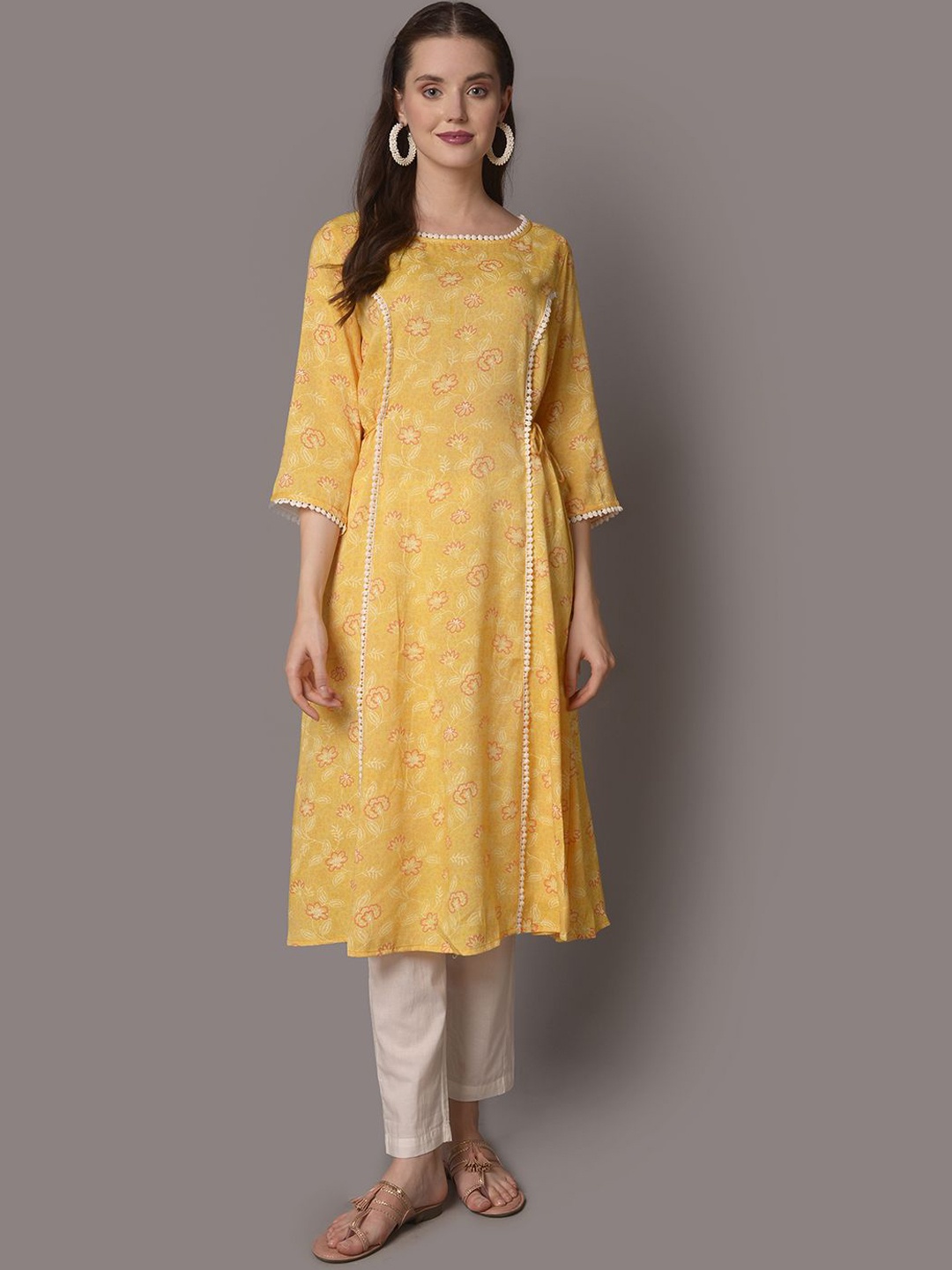 

Shree Floral Printed Thread Work Liva A-Line Kurta, Yellow
