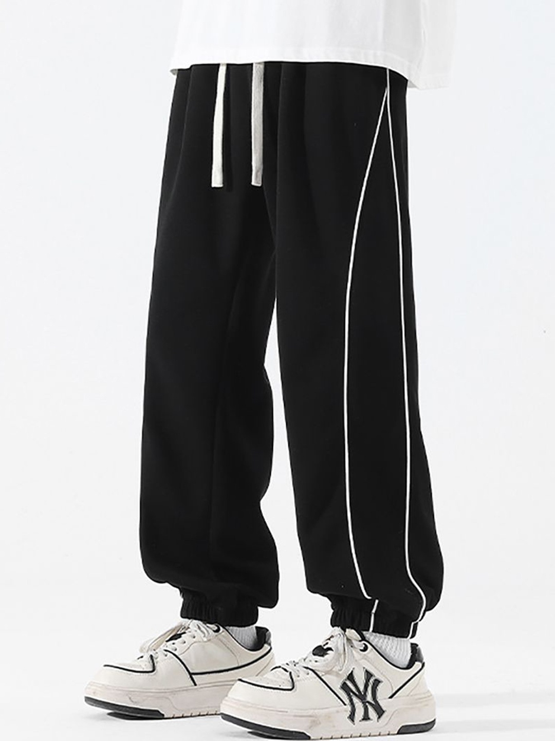 

StyleCast x Revolte Men Solid Loose Fit Joggers Trousers, Black