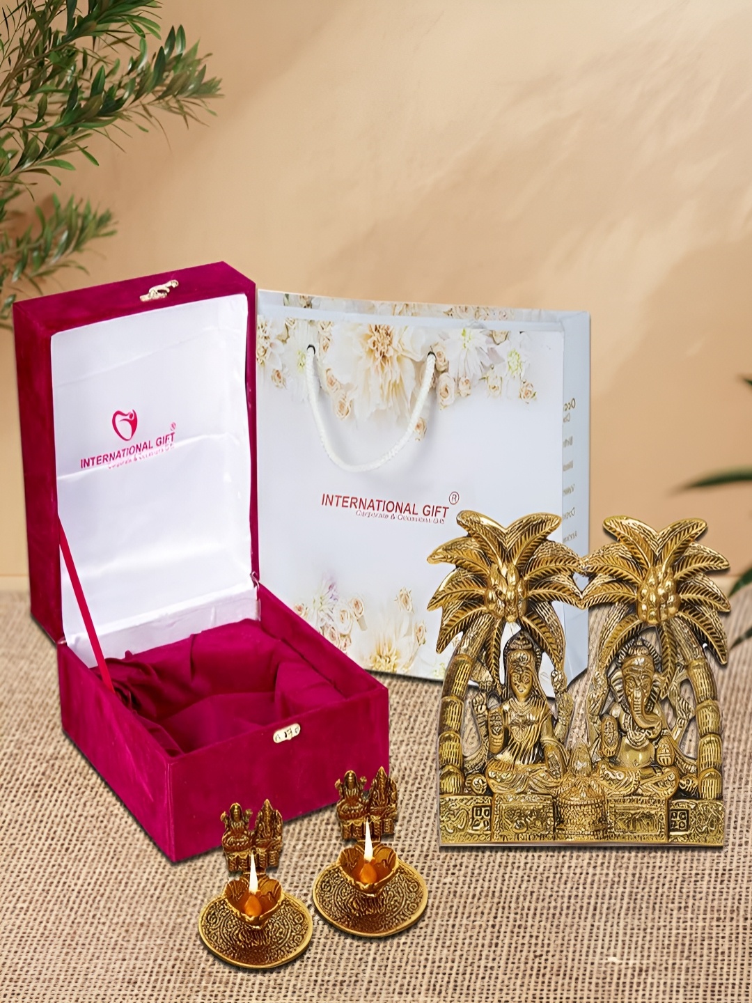 

INTERNATIONAL GIFT Gold-Toned 4 Pieces Religious Idol Showpiece With Diyas & Box