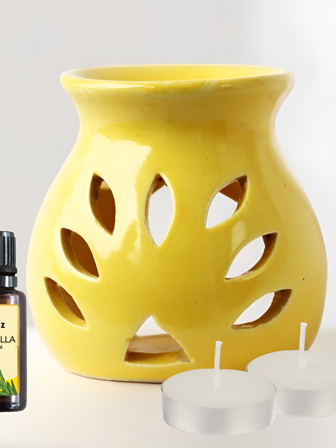 

Brahmz Blue 4 Pieces Candle Square Pot With Tealights & Rose Oil Aroma Diffusers, Yellow