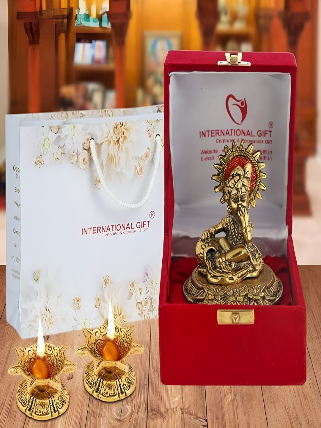 

INTERNATIONAL GIFT Gold-Toned Religious Figurine Showpiece With Diyas & Velvet Box