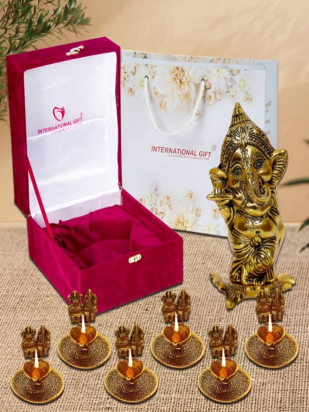 

INTERNATIONAL GIFT Gold-Toned 8 Pieces Religious Idol Showpiece With Diyas & Box